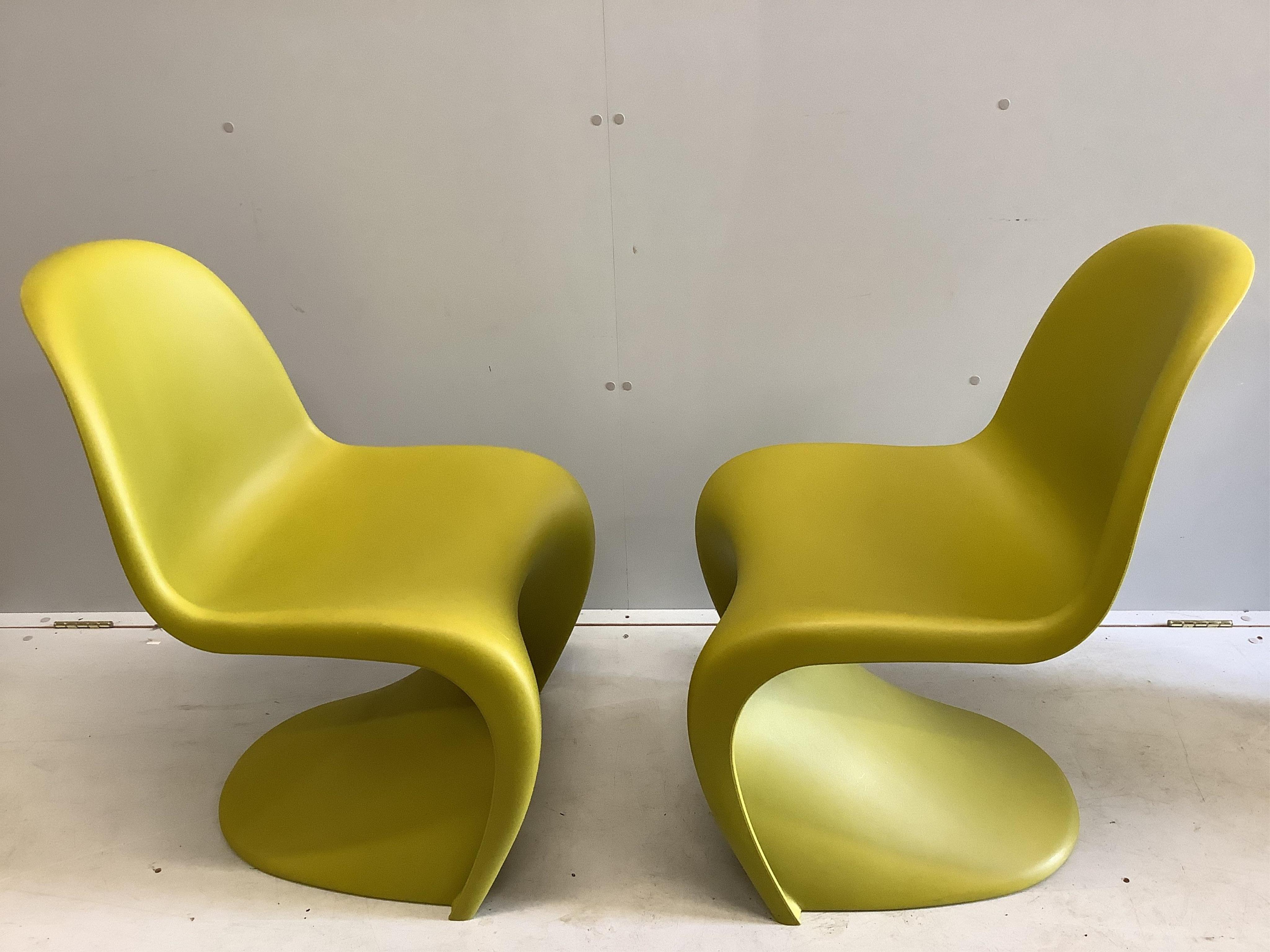 Two moulded plastic chairs by Verner Panton for Vitra, width 48cm, depth 58cm, height 82cm